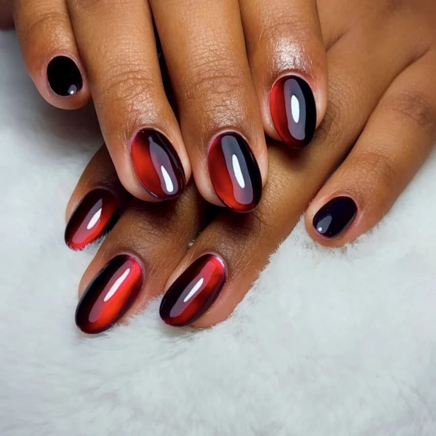 Uñas bicolor rojo y negro con acabado espejo
